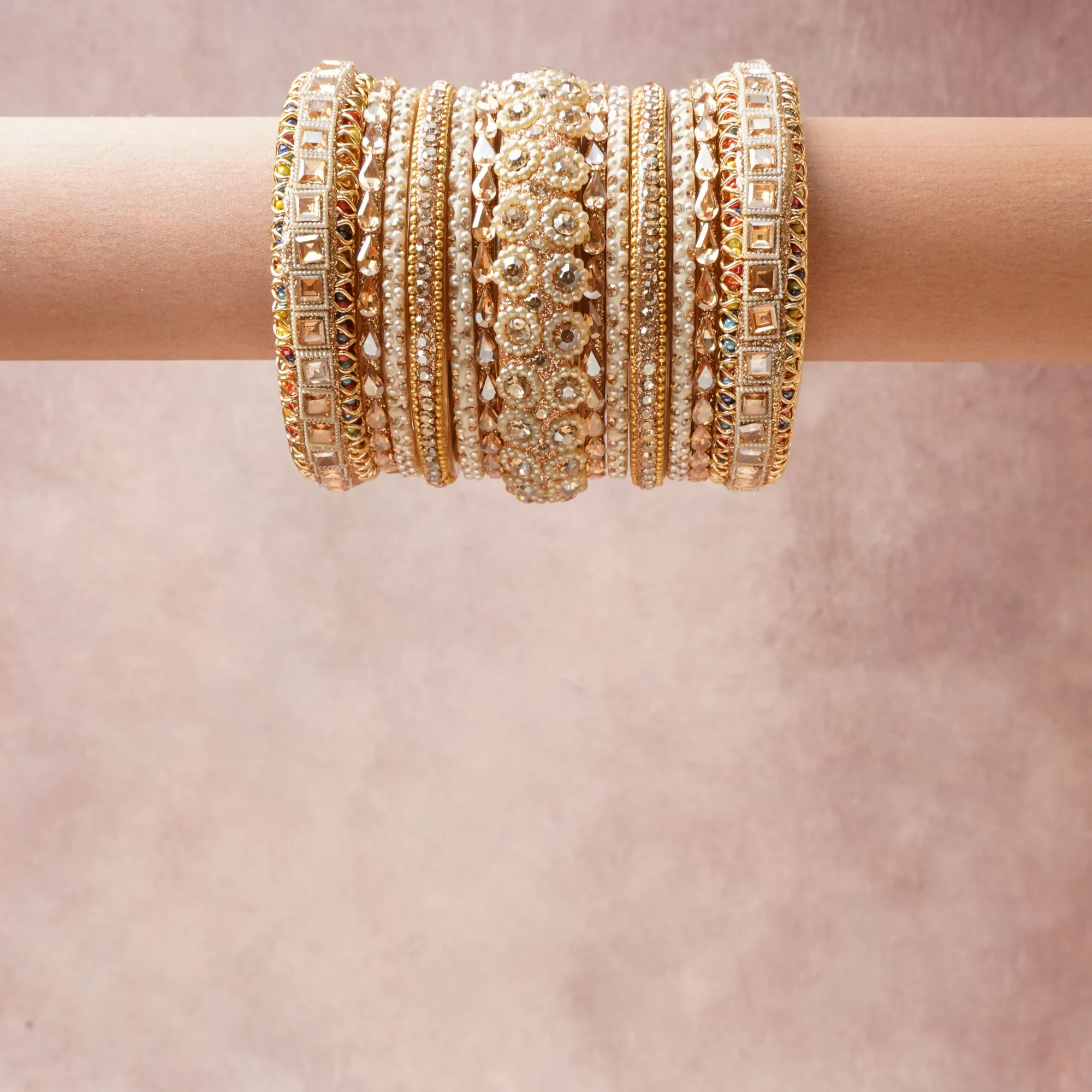 A commanding Gold anchors this beautiful set, enriched with accents of Clear, Cream, Champagne, Multicolor Pastels that add depth and dimension.

Featuring a striking composition of Gold-toned Metal, Pearls, Crystals, Faceted Glass Stones, this set carries intricate craftsmanship and strong presence. Grand in form, it is created for moments that deserve to be marked.